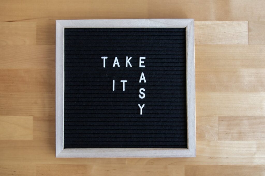Blackboard sign with 'Take It Easy' message, perfect for relaxation themes.