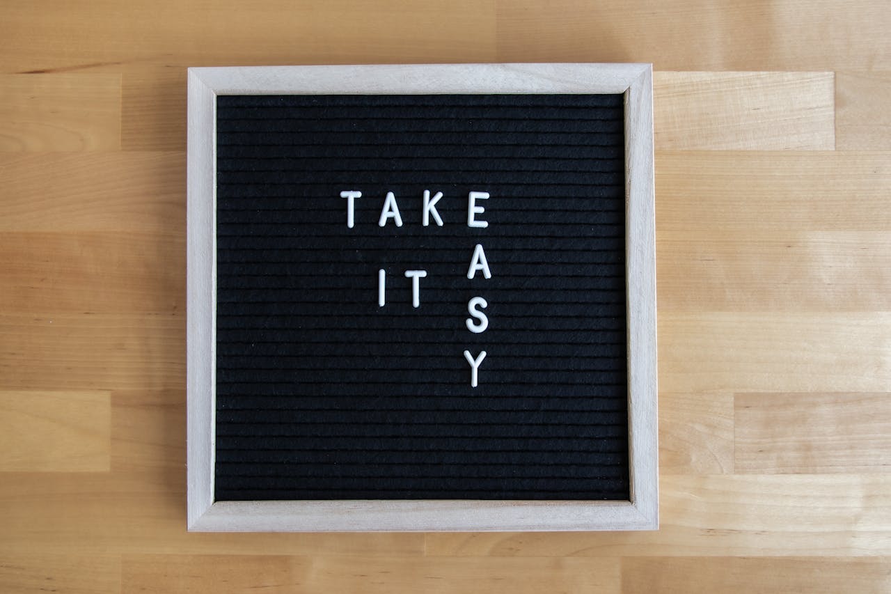 Blackboard sign with 'Take It Easy' message, perfect for relaxation themes.